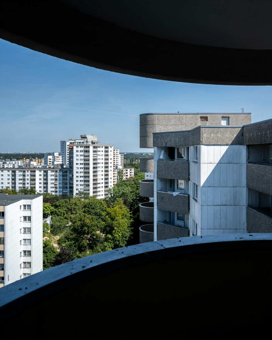 the view from the window of a building shows a city